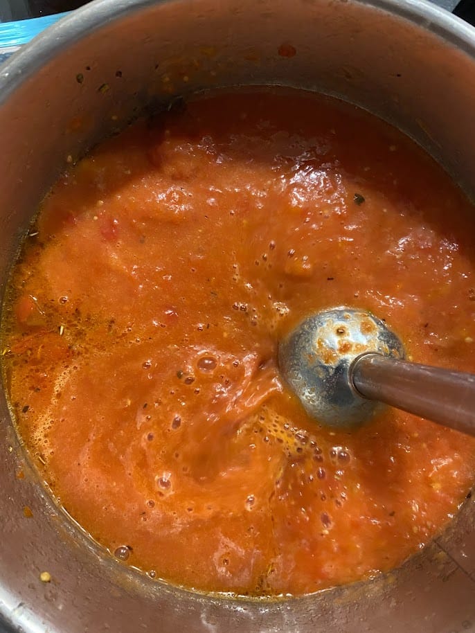 Mix the tomatoes until smooth with an immersion blender
